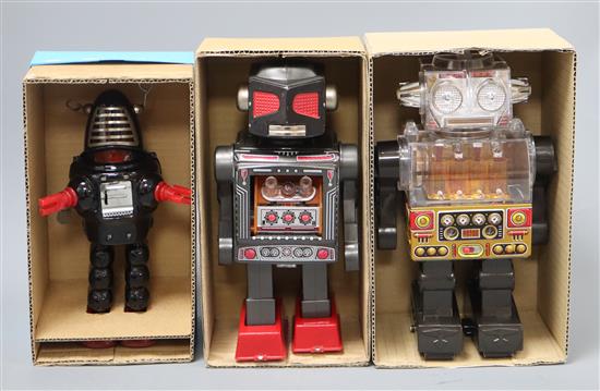 A Horikawa, Japan battery-operated Piston Robot and two other robots,